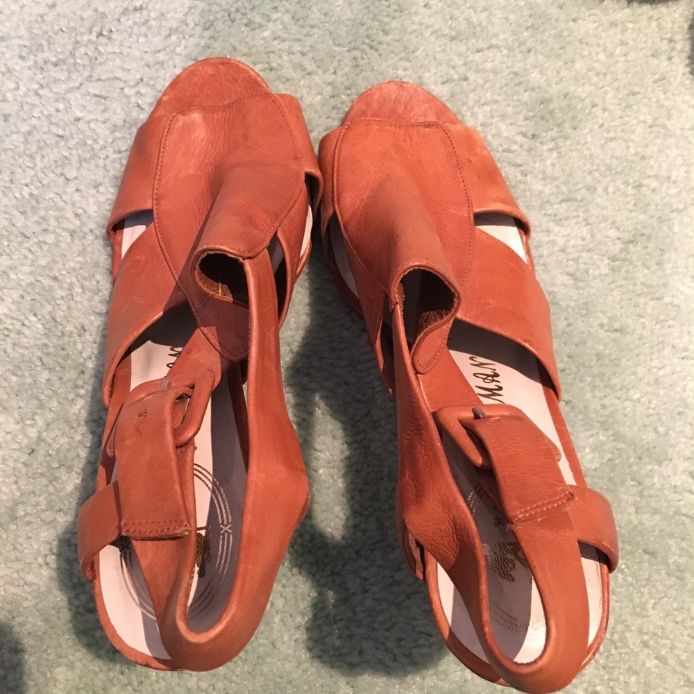 Brown heels by Delma man